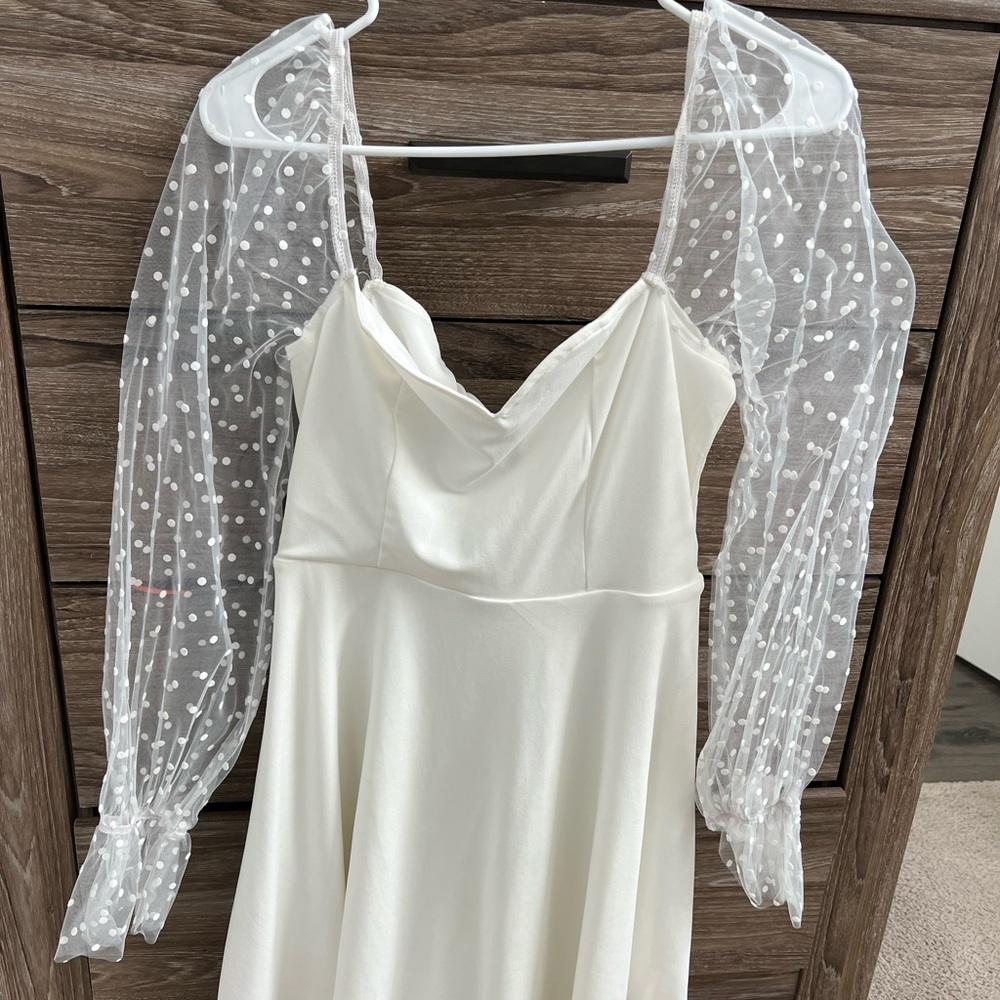 Elegant White Dress with Sheer Polka Dot Sleeves